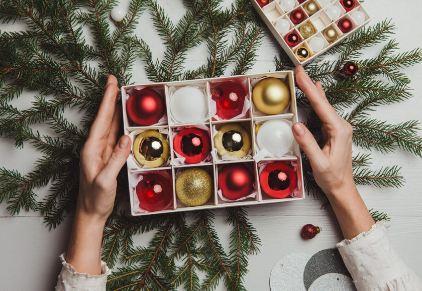 Christmas decoration from above overhead with woman hands