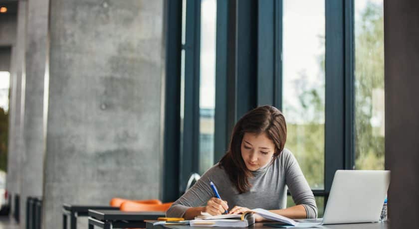 Asian student studying in library