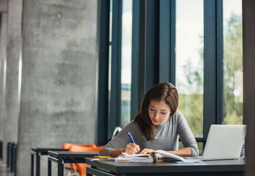 Asian student studying in library